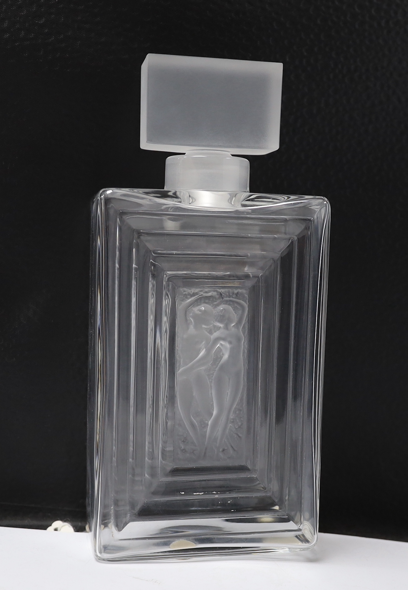 Two Lalique Duncan pattern glass scent bottles and stoppers and a matching toilet box and cover, tallest 20cm